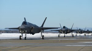 F-35A Lightning IIs assigned to the 354th Fighter Wing taxi on the flightline during Arctic Gold 21-2 April 7, 2021, on Eielson Air Force Base, Alaska. In addition to launching more than a dozen F-35As, the 354th Fighter Wing practiced processing and simulated deploying all required cargo for the aircraft. (U.S. Air Force photo by Senior Airman Beaux Hebert)