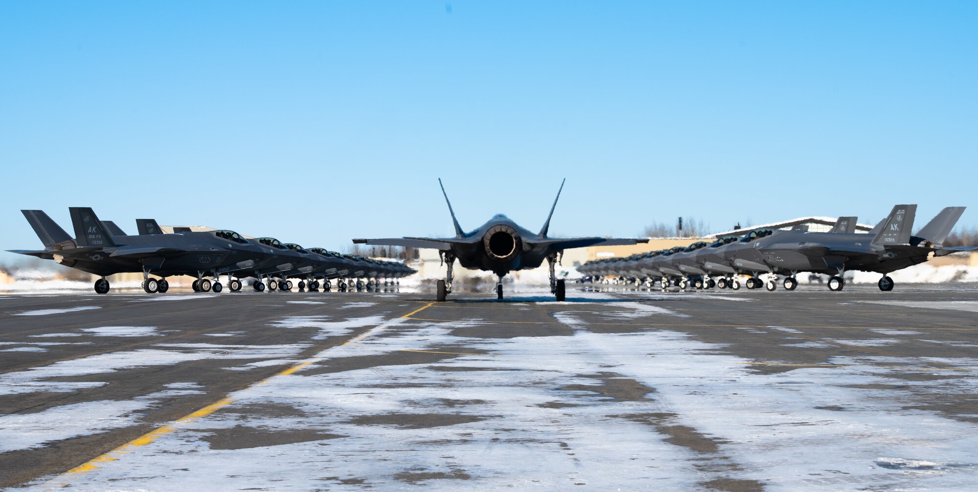 Twenty five F-35A Lightning IIs assigned to the 354th Fighter Wing assemble on the flightline prior to taking off during Arctic Gold (AG) 21-2 at Eielson Air Force Base, Alaska, April 7, 2021. AG 21-2 is a Phase I and Phase II readiness exercise designed to test the wing’s ability to rapidly generate and deploy F-35A Lightning II aircraft, cargo and supporting personnel. (U.S. Air Force photo by Airman 1st Class Jose Miguel T. Tamondong)