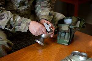 U.S. Air Force Chaplain (Maj.) Jeffery Scott, the 354th Fighter Wing (FW) deputy wing chaplain, packs a deployment kit during Arctic Gold 21-2 April 8, 2021, on Eielson Air Force Base, Alaska.  In addition to deploying, the 354th FW practiced processing and packing all required cargo for personnel. (U.S. Air Force photo by Senior Airman Beaux Hebert)