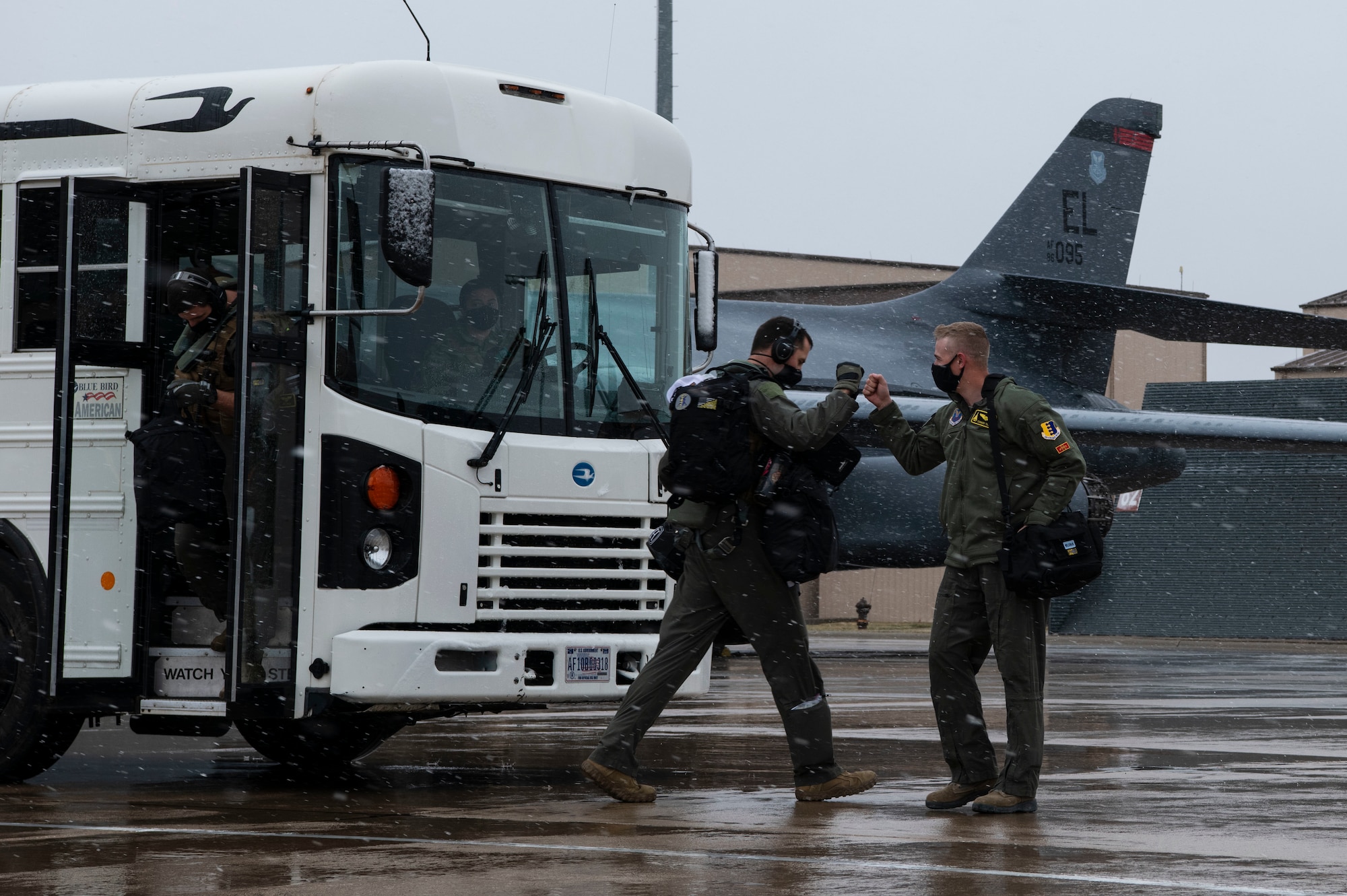 Aviators from the 37th Bomb Squadron greet each other before the start of a Bomber Task Force mission at Ellsworth Air Force Base, S.D., April 6, 2021.