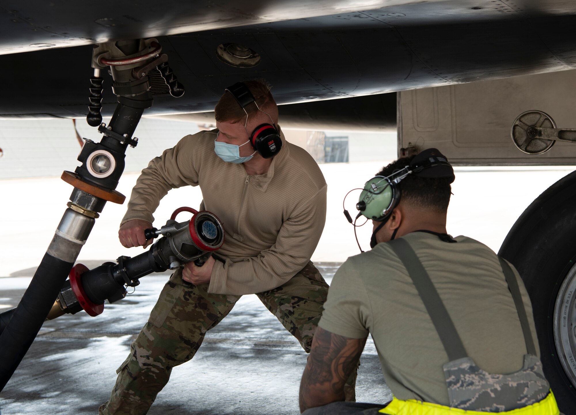 Airmen from the 28th Aircraft Maintenance Squadron prepare to fuel a B-1B Lancer at Ellsworth Air Force Base, S.D., April 5, 2021, in preparation for a Bomber Task Force mission.