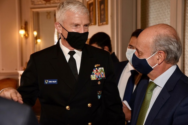 U.S. Southern Command’s commander, Navy Adm. Craig Faller, speaks with Uruguayan Minister of National Defense Javier Garcia.