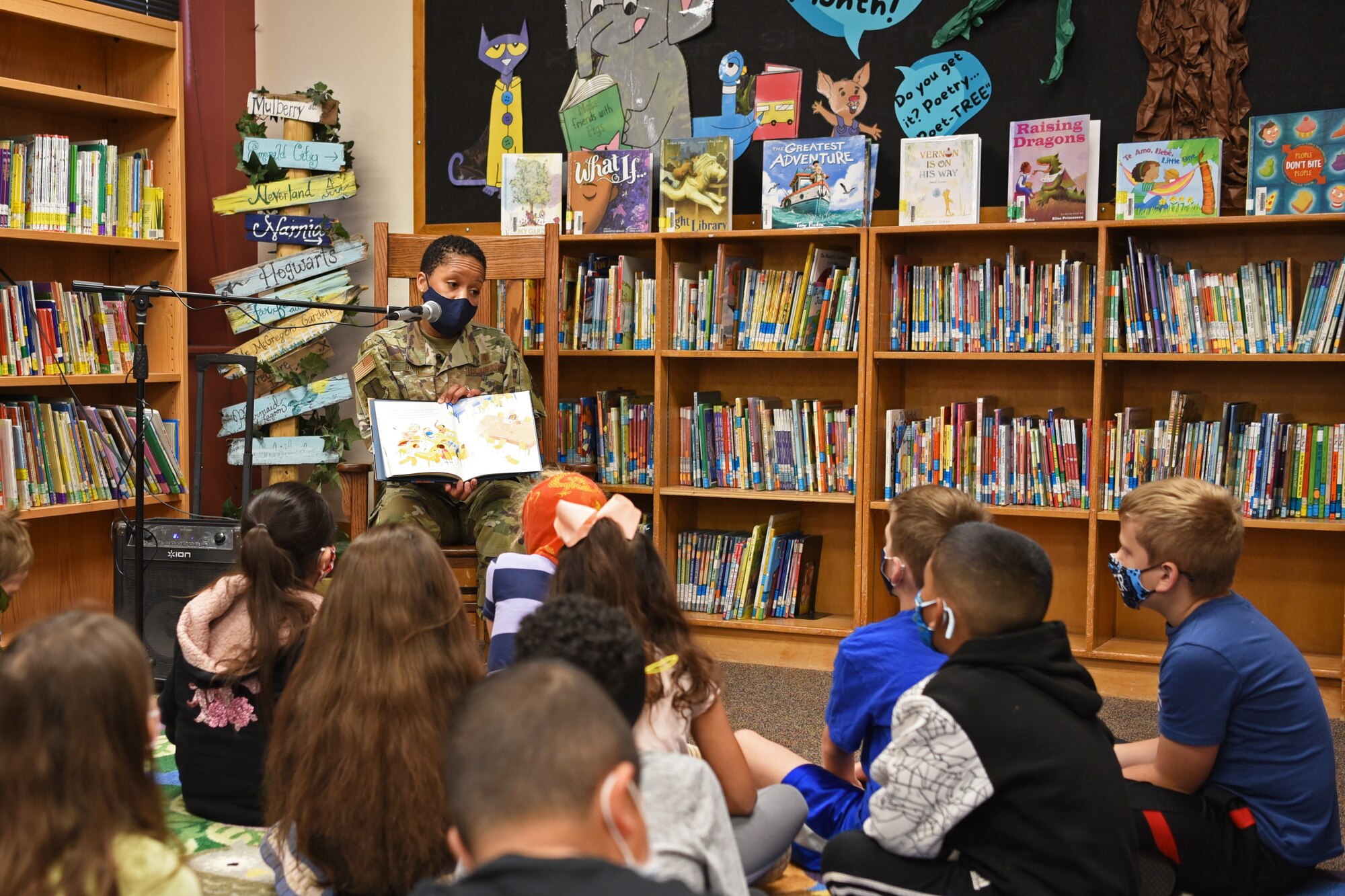 U.S. Air Force Col. Lauren Byrd, 17th Medical Group commander, reads to students at Glenmore Elementary, in partnership with San Angelo READS! and Month of the Military Child, in San Angelo, Texas, April 7, 2021. Byrd paused when reading the story to emphasize the importance of literacy and welcoming new students into the classroom. (U.S. Air Force photo by Senior Airman Abbey Rieves)