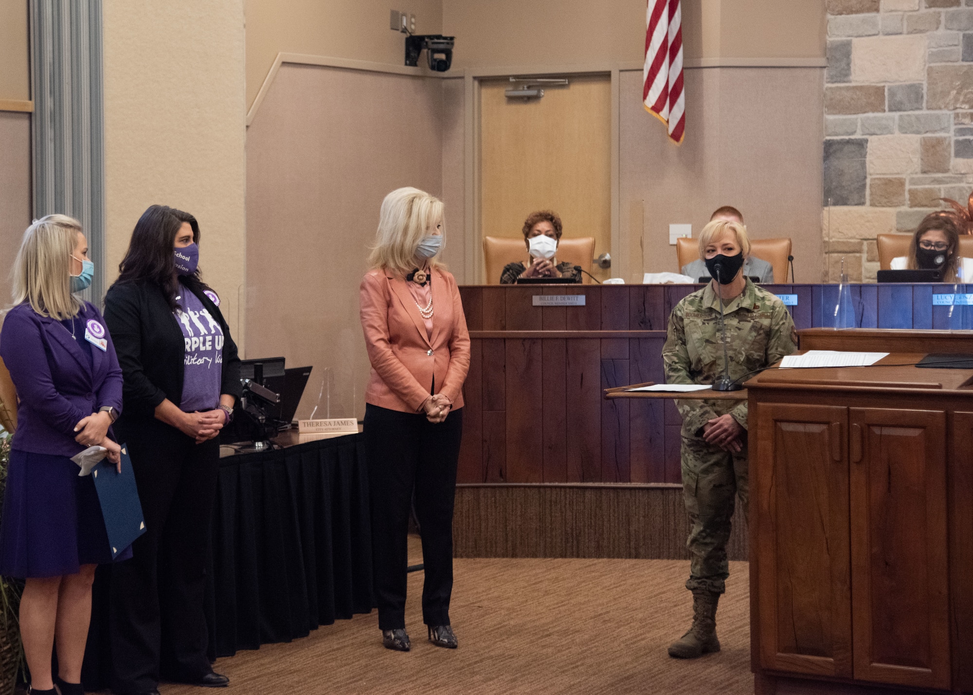 Chief Master Sgt. Casy Boomershine, 17th Training Wing command chief, provides remarks to the Mayor of San Angelo, Brenda Gunter, center, and the City Council at the proclamation singing event for the Month of the Military Child, during a monthly City Council meeting, April 6, 2021, at the McNease Convention Center in San Angelo, Texas. During the event, Gunter, proclaimed a city-wide recognition of April as the Month of the Military Child. (U.S. Air Force photo by Staff Sgt. Tyrell Hall)