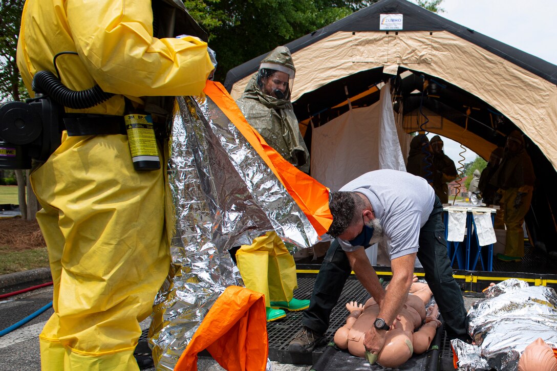 A photo of Airmen assessing a mock body.