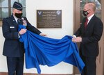 U.S. Air Force Lt. Gen. Brad Webb (left), commander of Air Education and Training Command, and retired Gen. Stephen Wilson (right), former Vice Chief of Staff of the Air Force, unveil the Wilson Hall dedication plaque April 9 at Joint Base San Antonio-Randolph. Wilson’s career began in AETC as a student pilot at Laughlin Air Force Base, Texas, followed by an assignment as a T-38 Talon instructor pilot there.