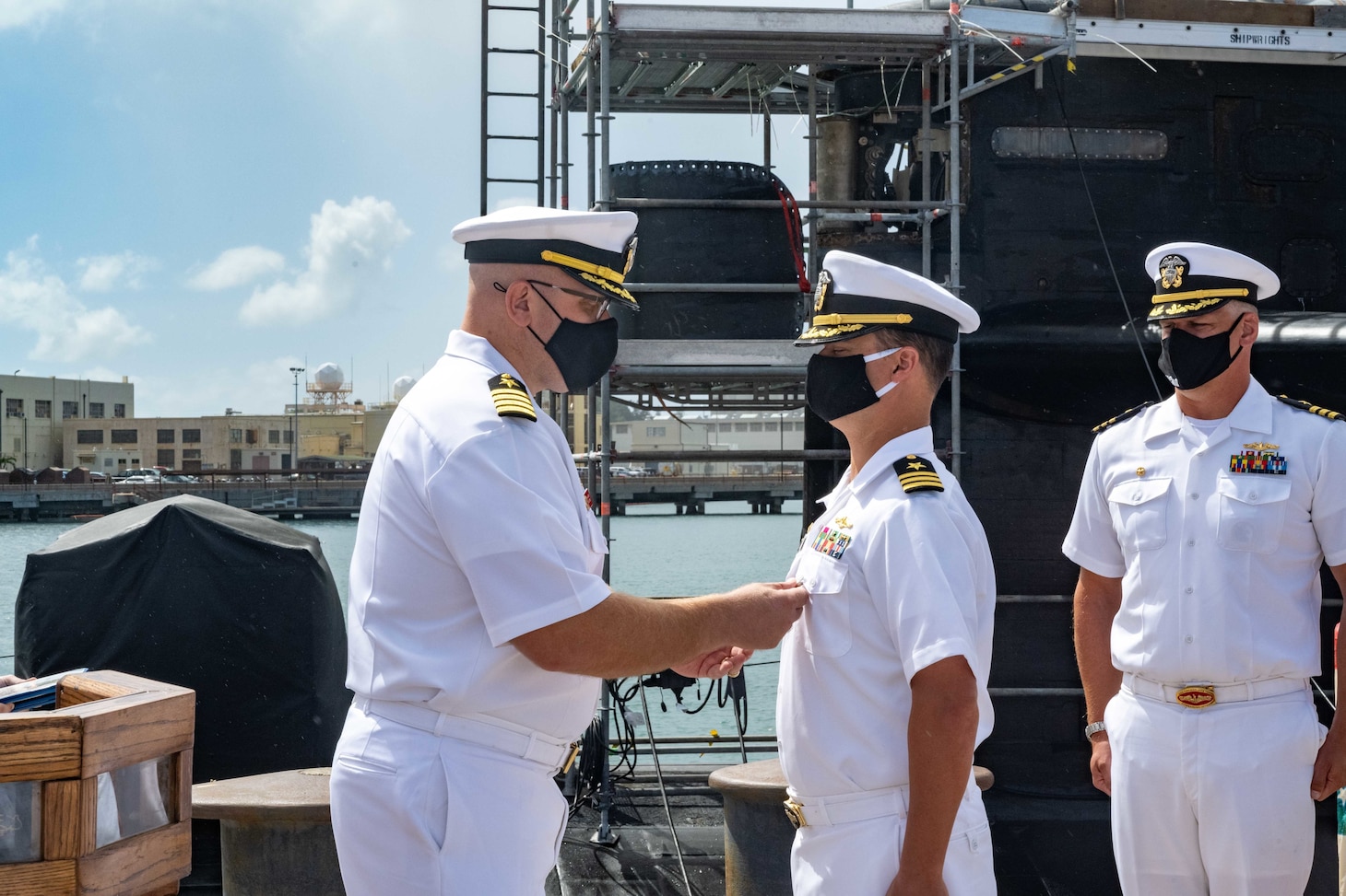 JOINT BASE PEARL HARBOR-HICKAM (April 7, 2021) -- Capt. Mike Majewski, left, commodore, Submarine Squadron 7, presents Cmdr. Chance Litton with his end of tour award during a change of command ceremony for the Los Angeles-class fast-attack submarine USS Chicago (SSN 721), April 7. Cmdr. Andrew J. Kopacz relieved Litton as Chicago's commanding officer during the ceremony on the historic submarine piers at Joint Base Pearl Harbor-Hickam. (U.S. Navy photo by Chief Mass Communication Specialist Amanda R. Gray/Released)