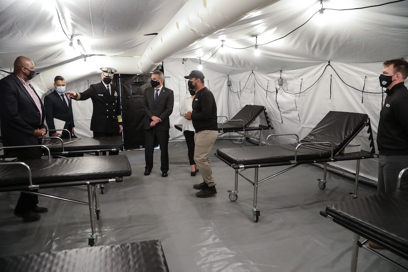 U.S. Southern Command’s commander, Navy Adm. Craig Faller, and Argentine Minister of Defense Agustin Rossi, tour one of three mobile hospitals donated by the United States to Argentina.