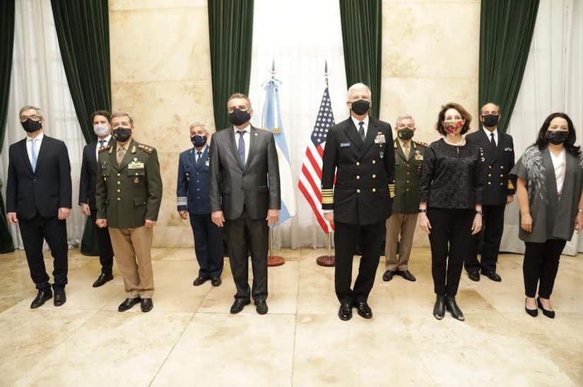 U.S. Southern Command’s commander, Navy Adm. Craig Faller, and Argentine Minister of Defense Agustin Rossi, pose for a photo with other senior leaders following a bilateral meeting to discuss security cooperation.