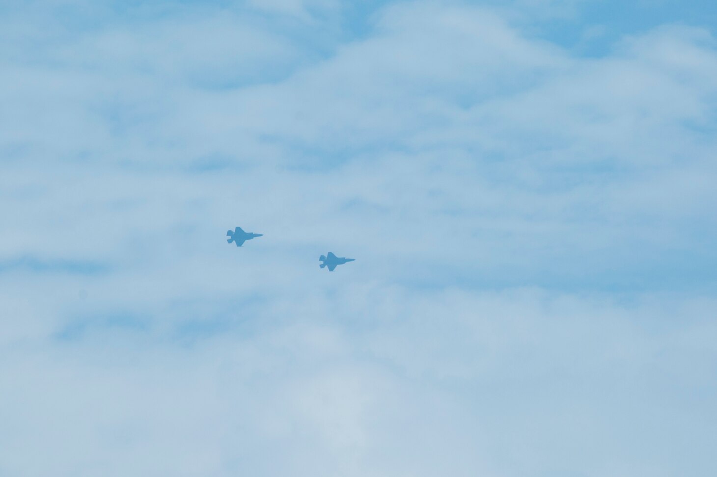 U.S. Marine Corps F-35B Lightning IIs assigned to Marine Medium Tiltrotor Squadron 164 (Reinforced), 15th Marine Expeditionary Unit, perform a fly by over the amphibious assault ship USS Makin Island (LHD 8). The Makin Island Amphibious Ready Group and embarked 15th MEU are operating in the U.S. 7th Fleet area of operations to enhance interoperability with allies and partners and serve as a ready response force to defend peace and stability in the Indo-Pacific region.