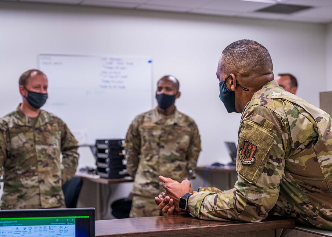 Air Transportation Specialists discuss the Air Terminal Operation Center’s role in moving personnel and cargo to Chief Master Sgt. Timothy C. White Jr., Command Chief Master Sergeant of Air Force Reserve Command, as he learned about the 96th Aerial Port Squadron’s mission, April 10, 2021, Little Rock Air Force Base, Ark. White visited several squadrons to see first-hand the capabilities of the 913th Reserve Citizen Airmen. (U.S. Air Force Reserve photo by Maj. Ashley Walker)