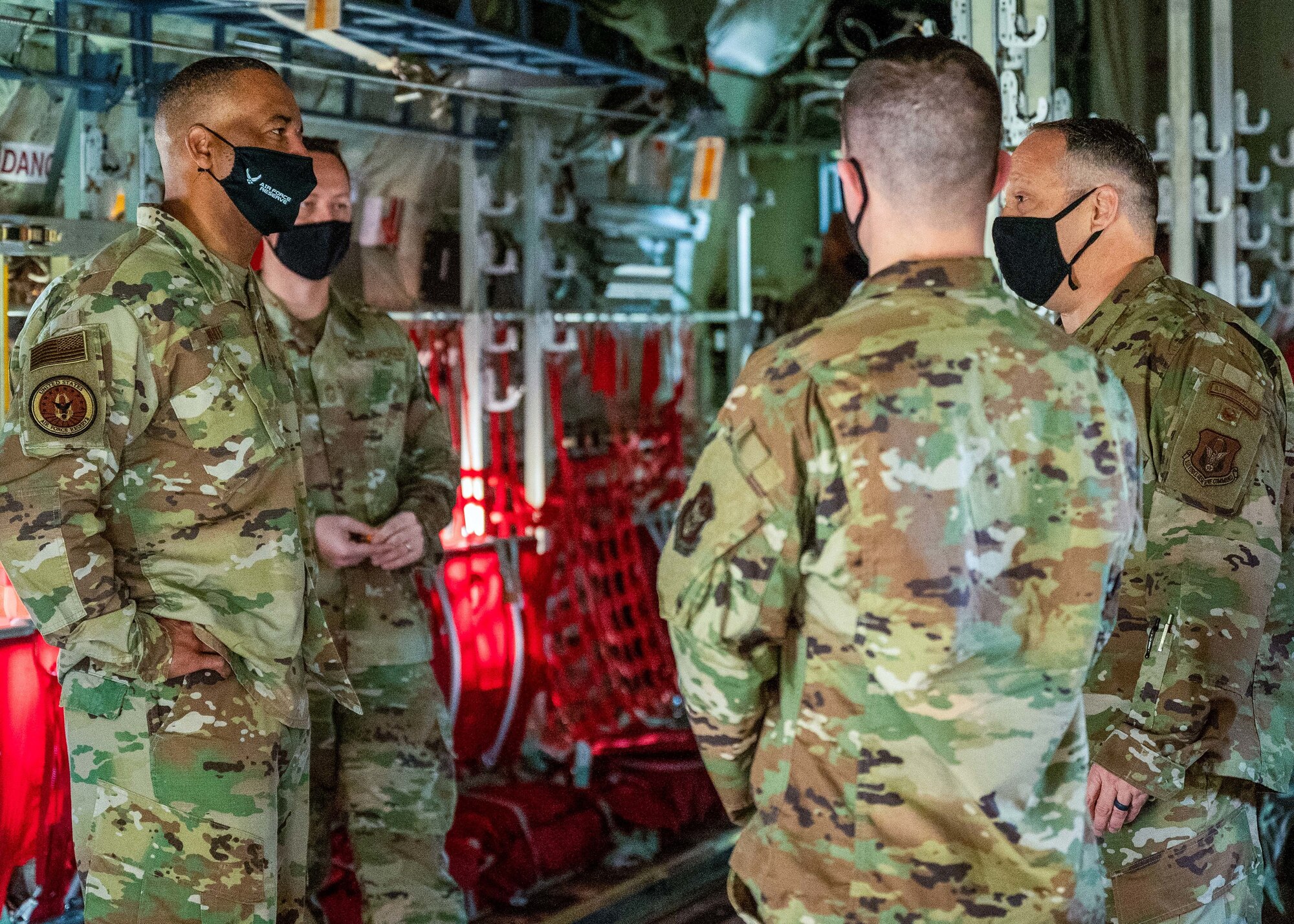 Lt. Col. Jason Kirk, 913th Maintenance Squadron officer and Tech. Sgt. Justin Craig, crew chief, discuss the capabilities of the C-130J Super Hercules aircraft to Chief Master Sgt. Timothy C. White Jr., Command Chief Master Sergeant of Air Force Reserve Command, during his visit to Little Rock Air Force Base, April 10, 2021. (U.S. Air Force Reserve photo by Maj. Ashley Walker)
