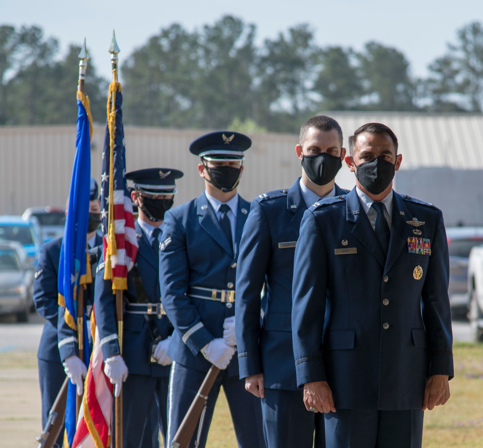 Col. Stuart M. Rubio, 403rd Operations Group commander at Keesler Air Force Base, Miss., and Capt. Grant J. Talkington, 5th Operational Weather Flight commander at Shaw Air Force Base, S.C., along with members of the Shaw AFB honor guard await commands during an assumption of command ceremony at the 28th Operational Weather Squadron pavilion April 9, 2021. Talkington assumed command of the flight after previously serving as its director of operations. (U.S. Air Force photo by Staff Sgt. Kristen Pittman)