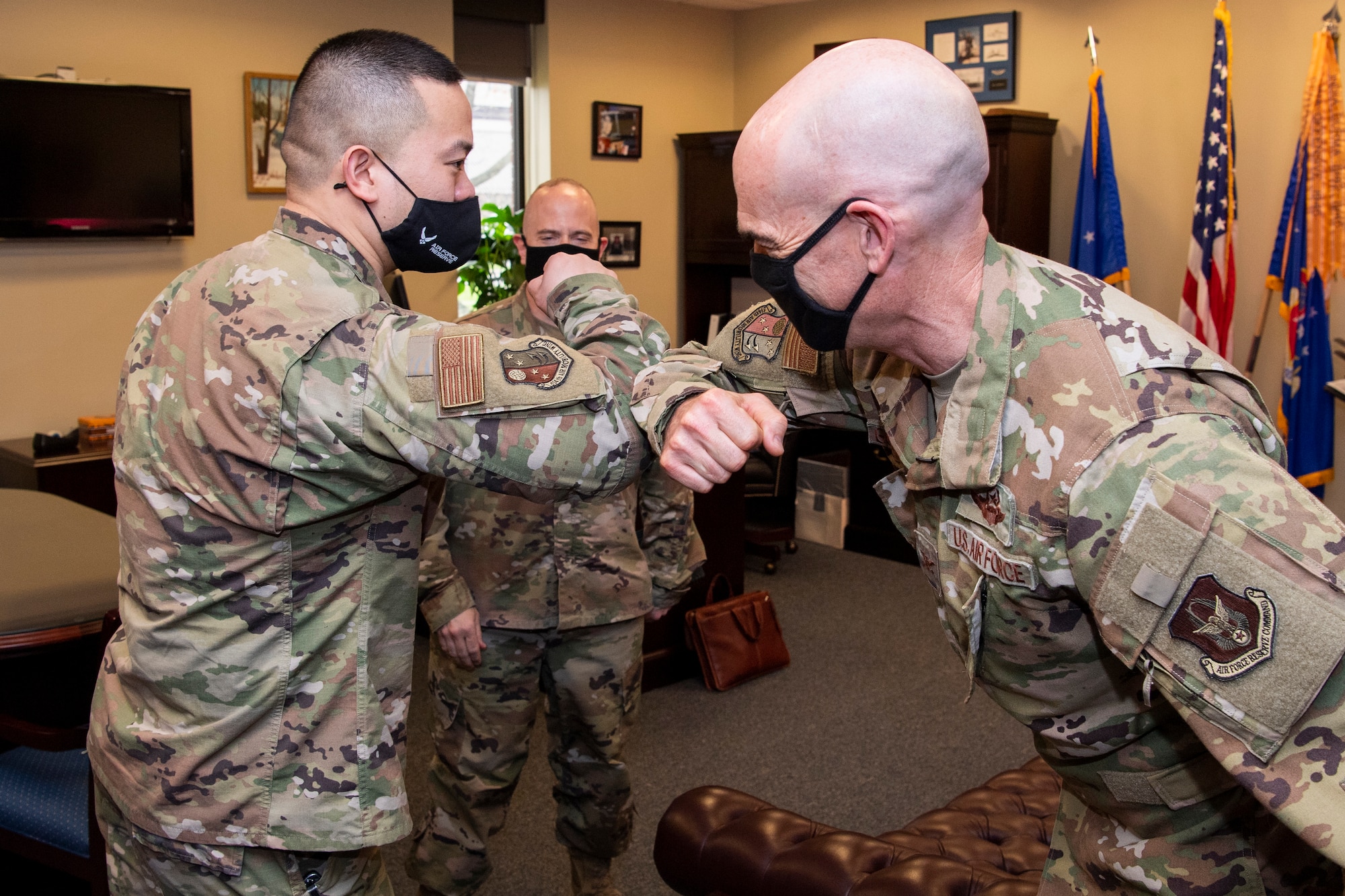 Reserve Citizen Airmen Master Sgt. Donald A. Ramos, superintendent of religious affairs with the 514th Air Mobility Wing, speaks with Col. William H. Gutermuth, 514th AMW commander at Joint Base McGuire-Dix-Lakehurst, N.J., April. 10, 2021. Ramos received the 2020 Air Force Chaplain Corps Citizen Airman Award, given to the most deserving outstanding reserve religious affairs airman.