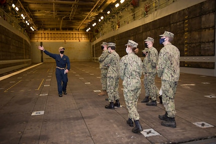 Midshipmen visit the San Antonio-class amphibious transport dock ship USS Arlington (LPD 24), April 11. 180 midshipmen from the United States Naval Academy (USNA) visited Naval Station Norfolk, April 10-11. This is the first of several fleet orientation weekends in April which will introduce more than 500 midshipmen to the surface and amphibious warfare force. (U.S. Navy photo by Mass Communication Specialist 2nd Class Jacob Milham/Released)