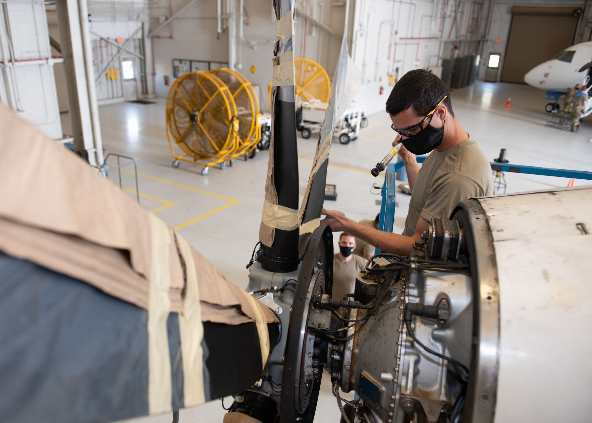 Airman inspects connections