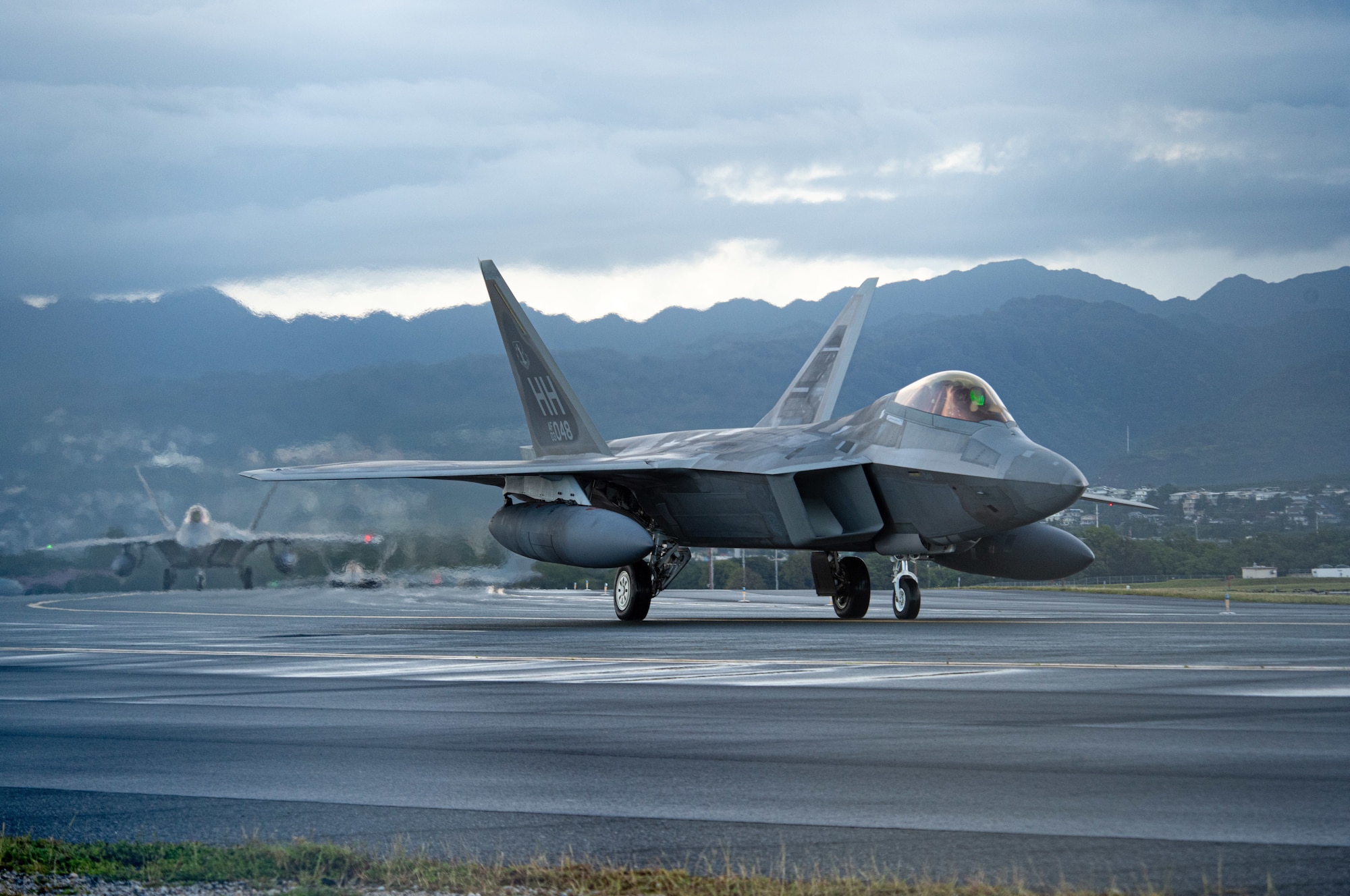 A Hawaii Air National Guard F-22 Raptor taxis March 11, 2021 at Honolulu International Airport, Hawaii. The Raptor flew alongside F-16 Fighting Falcons from Eielson Air Force Base, Alaska, during a final training sortie for exercise Pacific Raptor.