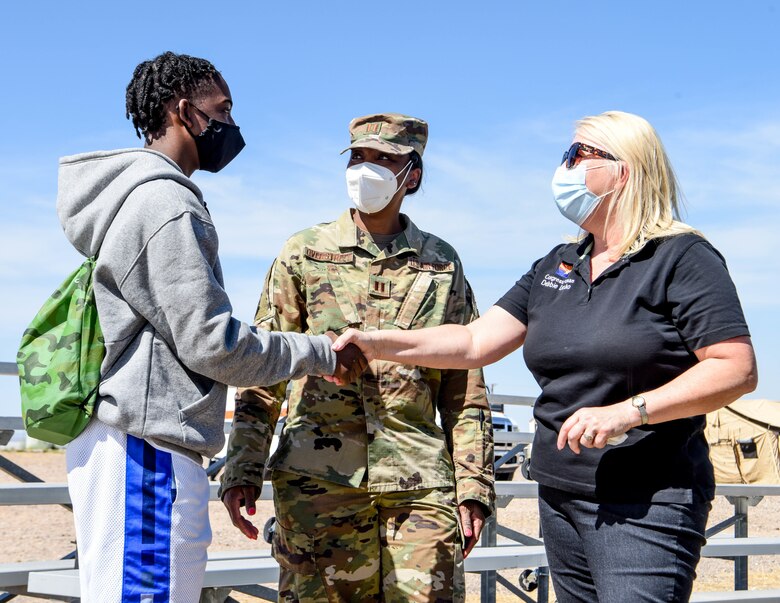 U.S. Representative Debbie Lesko (right), Arizona, meets Capt. Sparkle Overstreet, 944th Medical Squadron clinical nurse (center), and her son Mareon, 14, during a visit to Luke Air Force Base, Arizona, April 10. During her visit, the congresswoman stressed the importance of taking care of Reserve Citizen Airmen and their families.