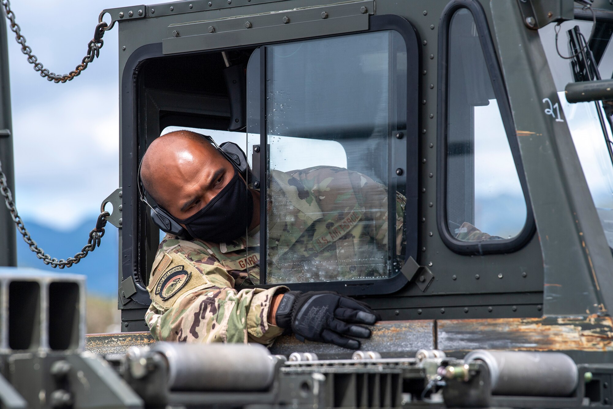 Tech. Sgt. Jesse Garo, 48th Aerial Port Squadron, drives a 60K loader toward a C-17 during a joint exercise while at Joint Base Pearl Harbor-Hickam, Hawaii, April 11, 2021.