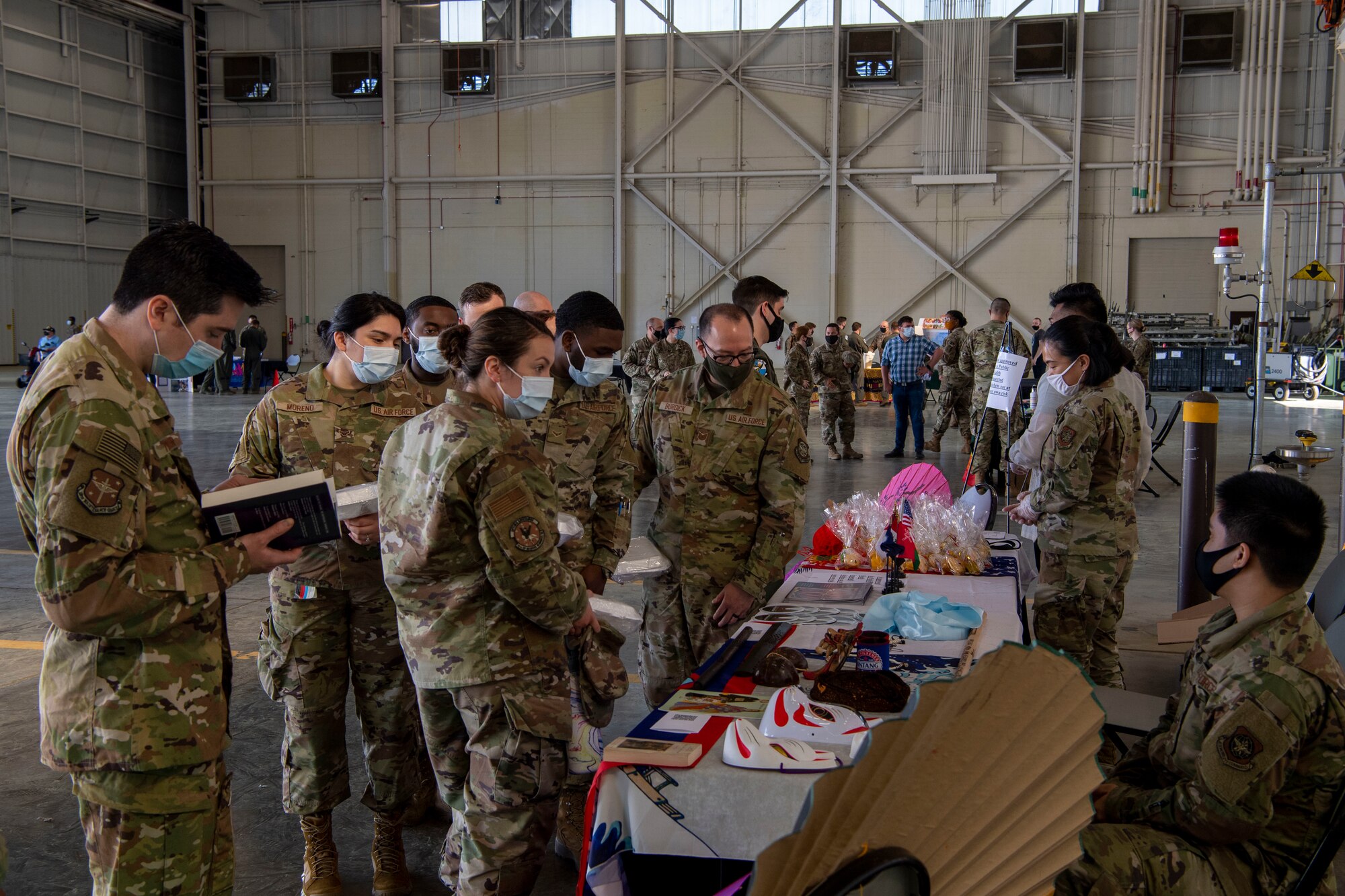 Airmen view a booth