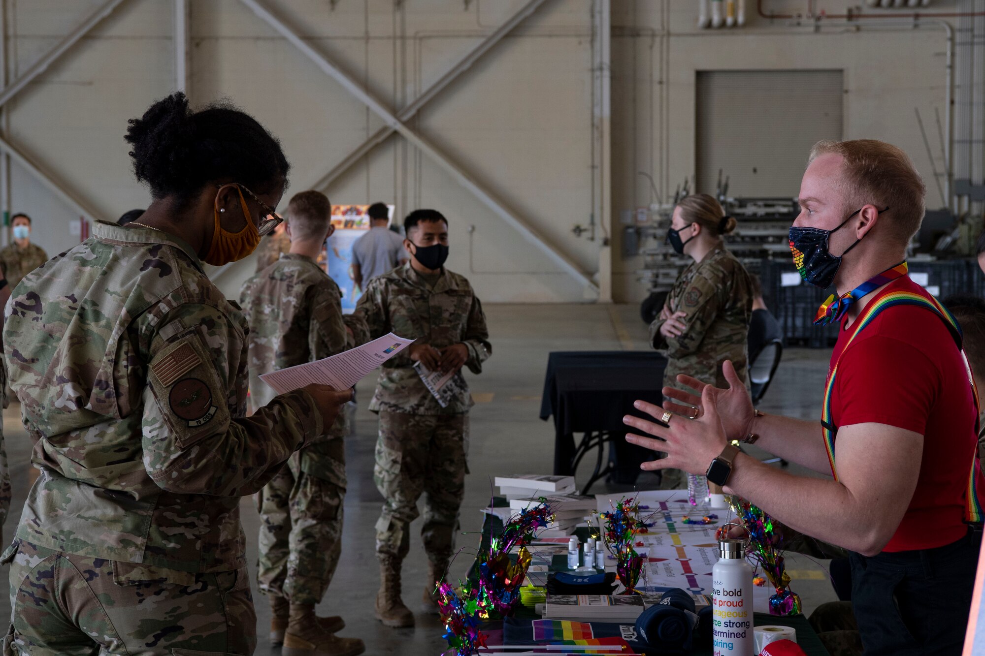 Airmen view a booth