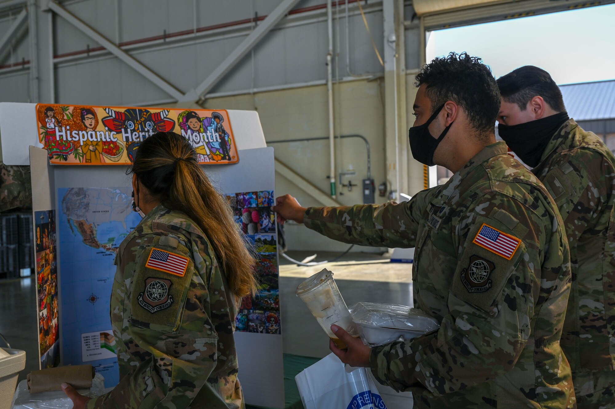 Airmen view a booth