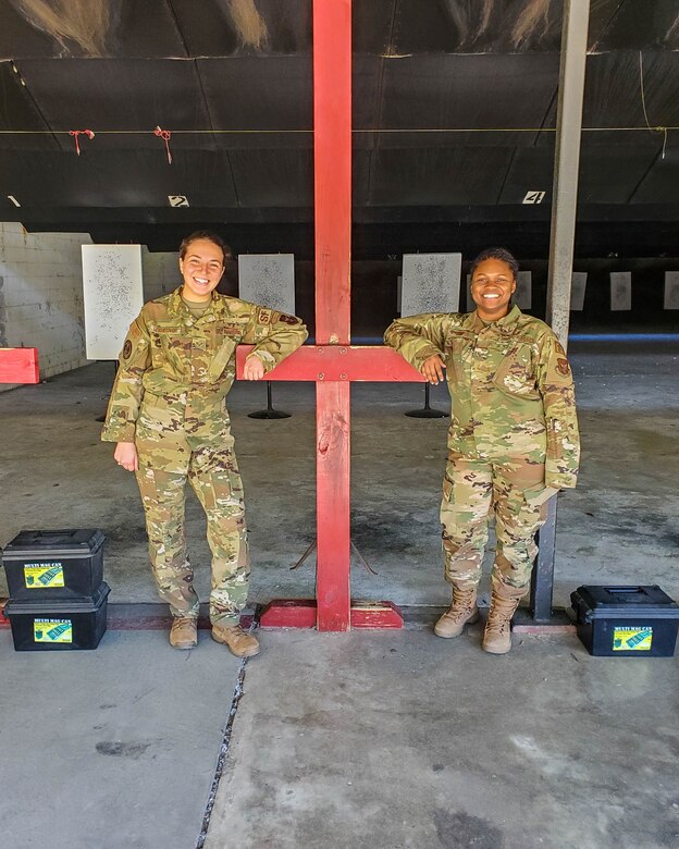 Senior Airman Sydney Lewandowski and Senior Airman Destiny Cooper train at the firing range at Joint Base Charleston, S.C. March 7, 2021. Training is an integral part of mission readiness and combat efficancy. Lewandowski is a Phoenix Raven and Cooper is a combat arms instructor and both are assigned to the 315th Security Forces Squadron.