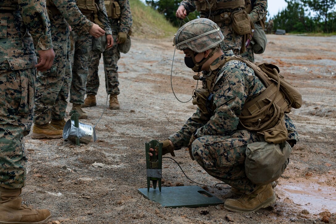 A U.S. Marine with Battalion Landing Team 3/4, 31st Marine Expeditionary Unit (MEU), sets up an expedient shape charge during a demolition range on Camp Hansen, Okinawa, Japan, April 8, 2021. The 31st MEU, the Marine Corps’ only continuously forward-deployed MEU, provides a flexible and lethal force ready to perform a wide range of military operations as the premier crisis response force in the Indo-Pacific region. (U.S. Marine Corps photo by Cpl. Alexandria Nowell)
