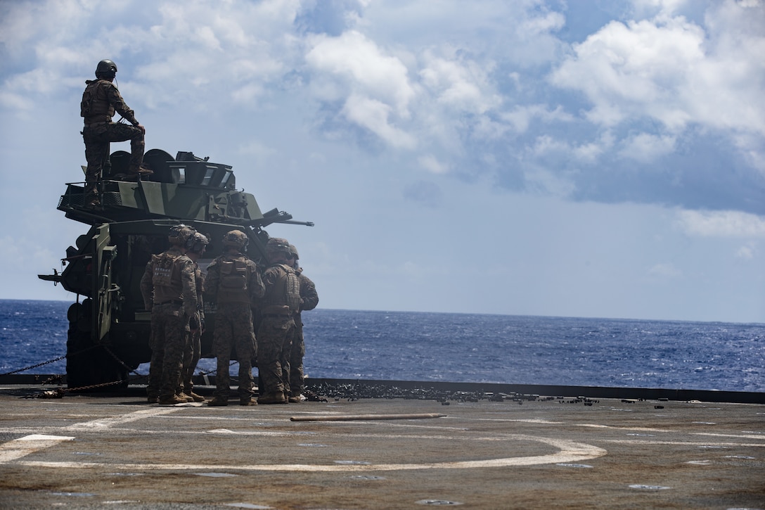U.S. Marines with 3rd Light Armored Reconnaissance (LAR), 31st Marine Expeditionary Unit (MEU), fire a Light Armored Vehicle (LAV) aboard dock landing ship USS Germantown (LSD 42), March 5, 2021. Marines with the 31st MEU regularly conduct deck shoots to maintain readiness and lethality. The 31st MEU is operating aboard ships of the Amphibious Squadron 11 in the 7th fleet area of operations to enhance interoperability with allies and partners and serve as a ready response force to defend peace and stability in the Indo-Pacific region. (Marine Corps photo by Lance Cpl. Joseph E. DeMarcus)