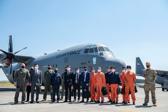 Yokota Airmen, Tokyo Metropolitan Police, and Japan Coast Guardsmen pose for a group photo