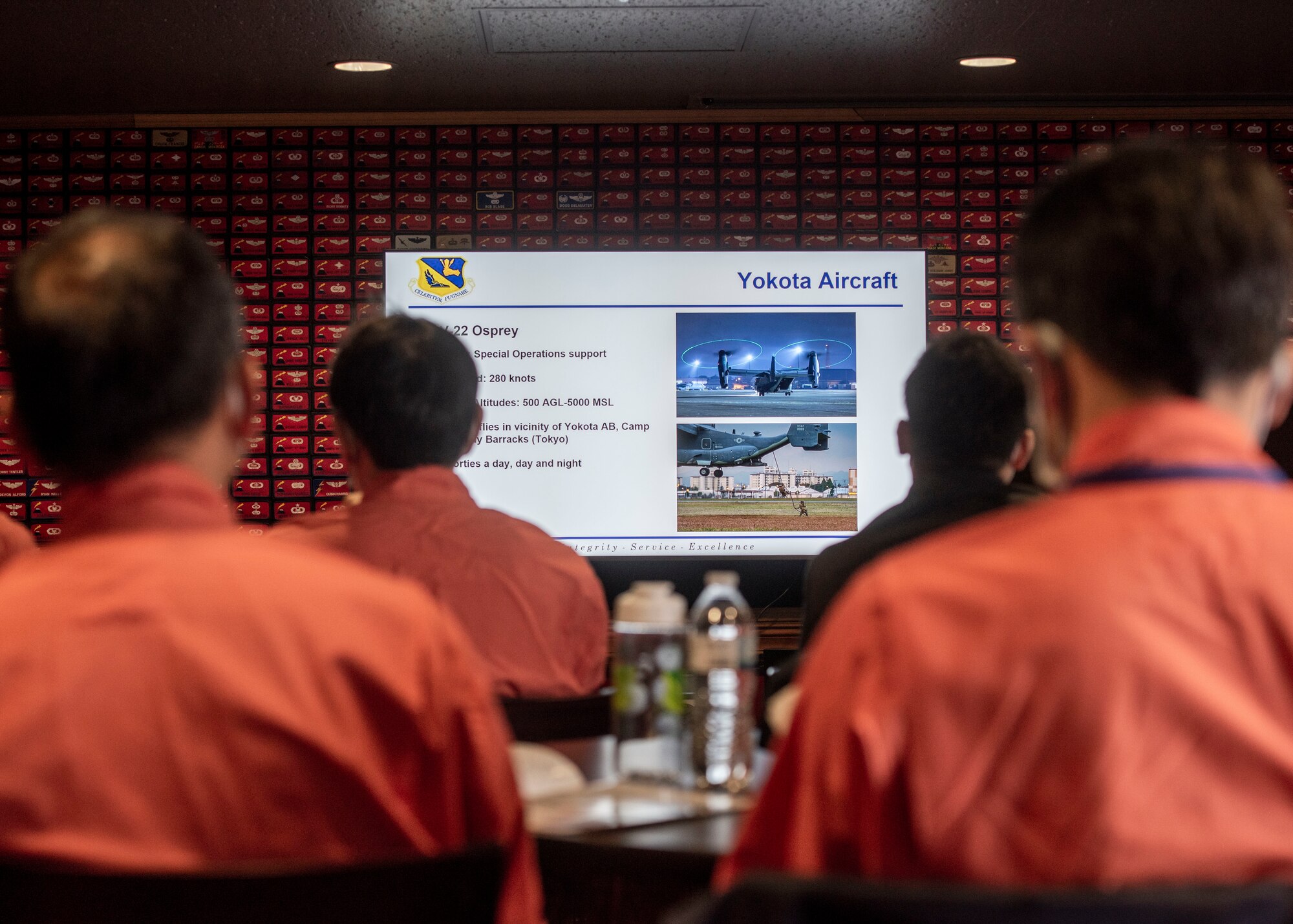 Tokyo Metropolitan Police and Japan Coast Guardsmen watch slideshow