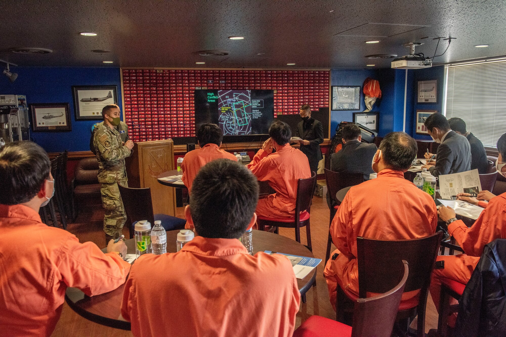 Tokyo Metropolitan Police and Japan Coast Guardsmen listen to a brief