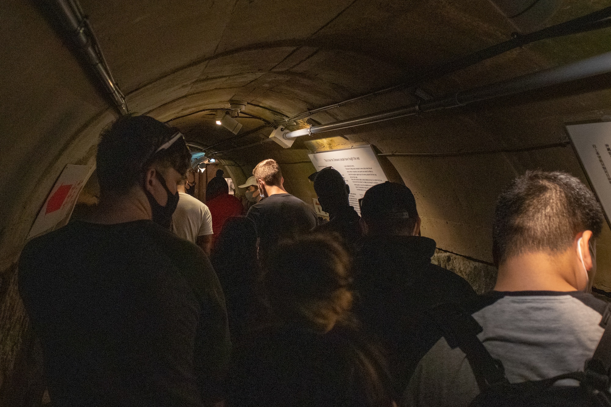 Airmen from the 18th Maintenance Group tour the tunnel complex of the Japanese Naval Underground.