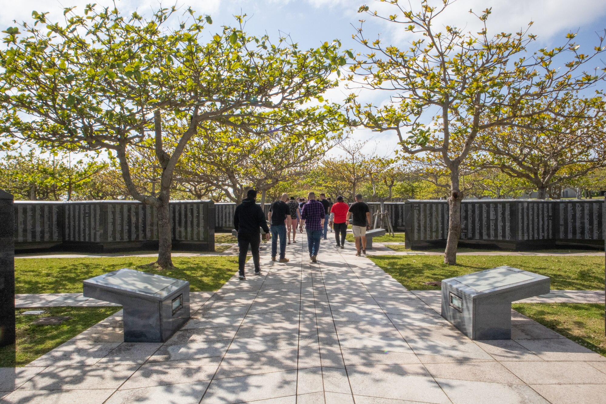 Airmen walk through Peace Prayer Park