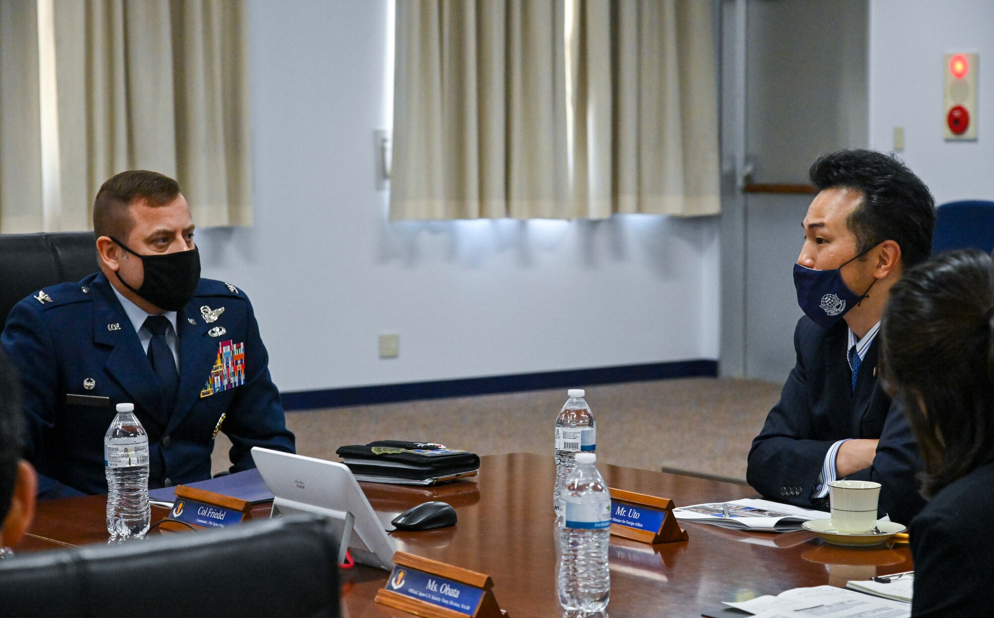 U.S. Air Force Col. Jesse Friedel, Misawa Air Base installation commander, listens to a question from Takashi Uto, Japan State Minister of Foreign Affairs, during his visit to Misawa Air Base, Japan, April 12, 2021. Uto discussed several topics with Misawa leaders, including how COVID-19 has affected operations and training within Japan. (U.S. Air Force photo by Tech. Sgt. Timothy Moore)