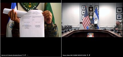 Col. Mario Adalberto Figueroa Cárcamo (left), Salvadoran Army chief of staff, shows his signed copy of the agreed-to-actions document between the U.S. and Salvadoran armies April 7 outlining future training commitments and professional exchanges between the two armies.