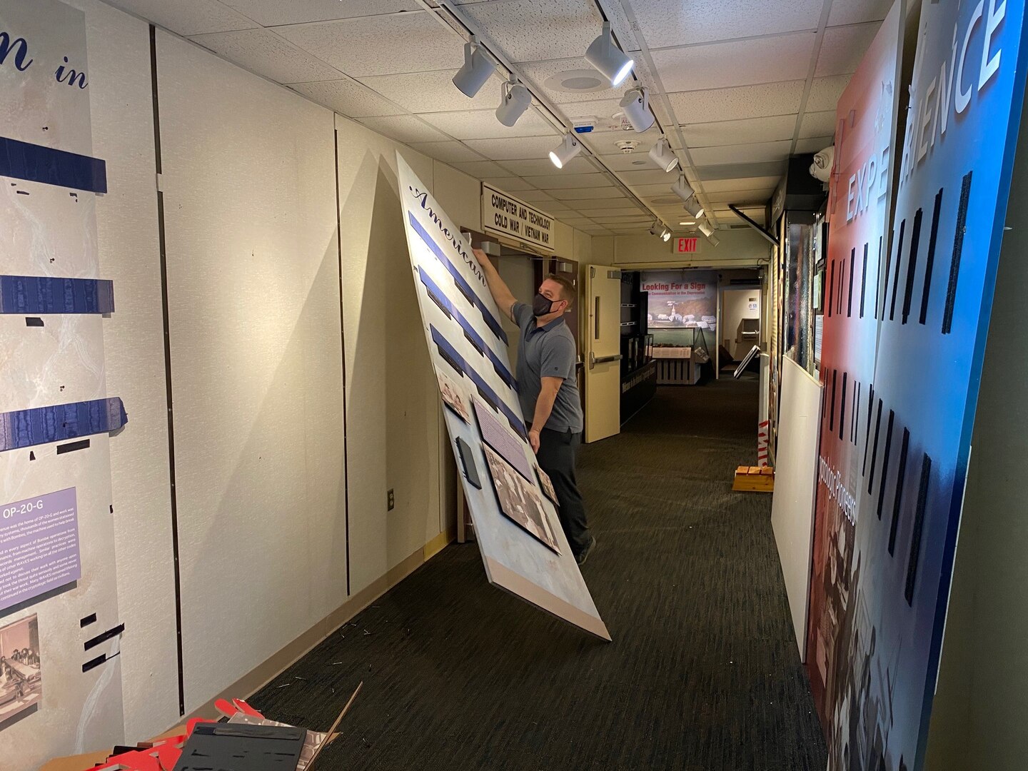 Museum Director Dr. Vince Houghton tears down old displays.