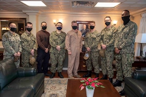 210411-N-AY174-1041 DUQM (April 11, 2021) - Vice Adm. Samuel Paparo, commander of U.S. Naval Forces Central Command (NAVCENT), U.S. 5th Fleet and Combined Maritime Forces, center, poses for a photo with Sailors aboard aircraft carrier USS Dwight D. Eisenhower (CVN 69) during a sustainment and logistics visit in Duqm, Oman, April 11. The Eisenhower Carrier Strike Group is deployed to the U.S. 5th Fleet area of operations in support of naval operations to ensure maritime stability and security in the Central Region, connecting the Mediterranean and Paciﬁc through the western Indian Ocean and three strategic choke points. (U.S. Navy photo by Mass Communication Specialist 3rd Class Brianna T. Thompson-Lee/Released)