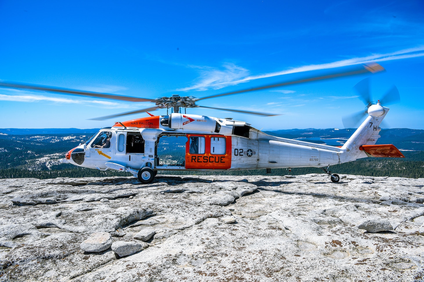 An MH-60S Knighthawk helicopter assigned to the “Longhorns” of Helicopter Search and Rescue (SAR) Squadron, lands during a Last Final Flight (LFF).