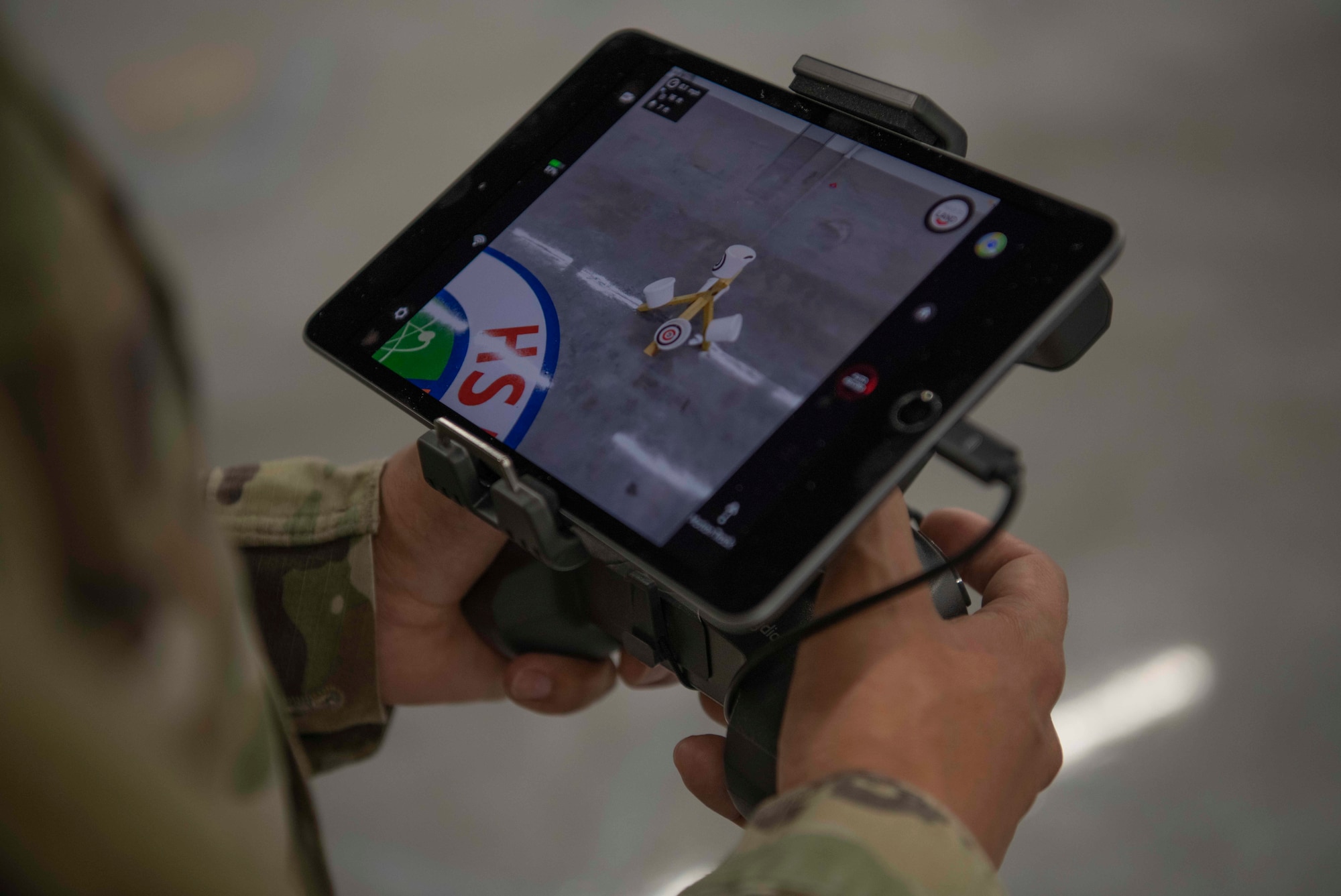 An Air Commando with the 1st Special Operations Civil Engineer Squadron learns how to fly an unmanned aircraft system at the FieldWerx Makerspace in Fort Walton Beach, Florida, April 6, 2021.