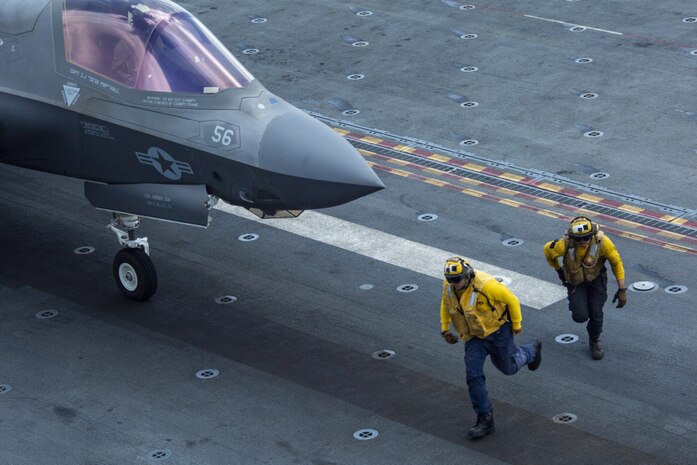 U.S. Sailors assigned to the amphibious assault ship USS Makin Island (LHD 8) clear out of the way of a U.S. Marine Corps F-35B Lightning II assigned to Marine Medium Tiltrotor Squadron 164 (Reinforced), 15th Marine Expeditionary Unit, in preparation for takeoff from the flight deck of the ship. The Makin Island Amphibious Ready Group and embarked 15th MEU are operating in the U.S. 7th Fleet area of operations to enhance interoperability with allies and partners and serve as a ready response force to defend peace and stability in the Indo-Pacific region.