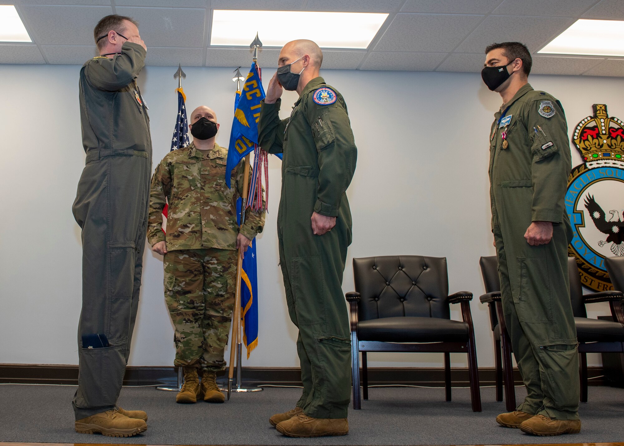 Lt. Col. Tanner Hein, center, incoming Headquarters Training Support Squadron Detachment 15 commander, salutes Lt. Col. Scott Major, left, Air Combat Command Training Support Squadron commander, as he accepts command during the Detachment 15 change of command ceremony at Seymour Johnson Air Force Base, North Carolina, April 9, 2021.