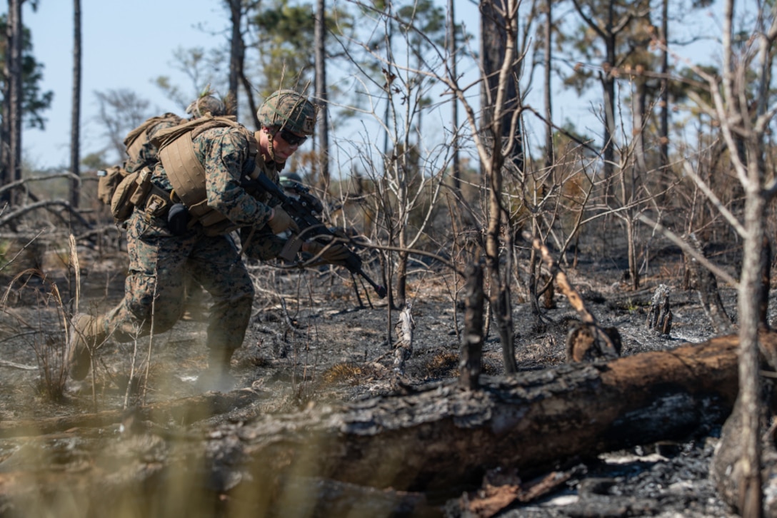 A U.S. Marine with Alpha Company, 1st Battalion, 6th Marine Regiment, 2nd Marine Division, buddy rushes during a squad fire and maneuver training event on Camp Lejeune, N.C., April 7, 2021. Marines with 1/6 conducted the exercise to maintain proficiency in squad combat maneuvers and the ability to operate in adverse environments. The training showcased their abilities as an apex battalion task force.