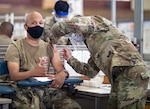 Lt. Col. John Gwinn, commander of the 3rd Battalion, 7th Field Artillery Regiment, 25th Infantry Division, receives the Pfizer-BioNTech COVID-19 vaccine at Schofield Barracks, Hawaii, Jan. 14, 2021.