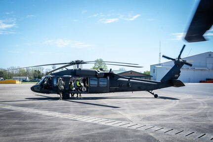 Tennessee National Guard’s UH-60L Black Hawk aircrew and Nashville Fire Department’s Helicopter-borne Aquatic Rescue Team prepare for the water rescue mission during a joint exercise near Smyrna’s National Guard Volunteer Training site, April 9.