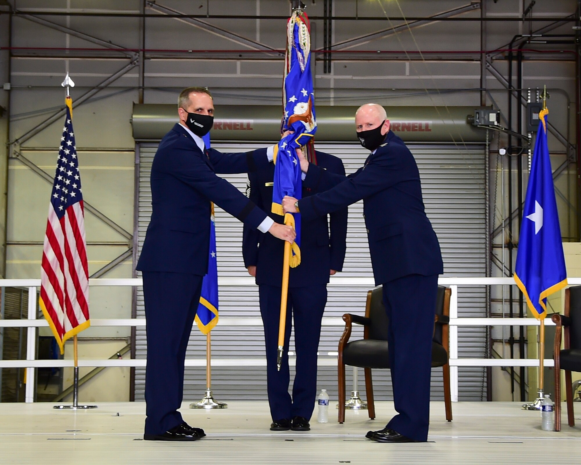 Brig. Gen. Jeffrey T. Pennington, 4th Air Force commander at March Air Reserve Base, California, passes the guidon to Col. Thomas O. Pemberton, 434th Air Refueling Wing commander, during an assumption of command ceremony at Grissom Air Reserve Base, Ind. April 10, 2021. Pemberton was previously the 514th Air Mobility Wing commander at Joint Base McGuire-Dix-Lakehurst, New Jersey. (U.S. Air Force photo by Staff Sgt. Chris Massey)