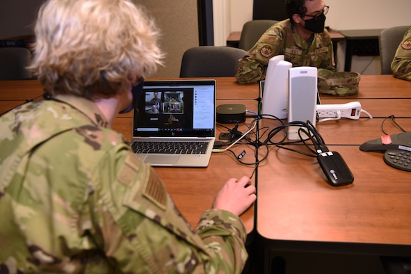 U.S. Air Force Chief Master Sgt. Breana Oliver, 17th Training Group superintendent, prepares a video chat for Maj. Gen. Leah Lauderback, director of Intelligence, Surveillance and Reconnaissance, U.S. Space Force and U.S. Space Force Chief Master Sgt. Roger Towberman, Chief Master Sergeant of the Space Force to talk with Guardians stationed at Goodfellow Air Force Base, Texas, April 5, 2021. Guardians stationed at Goodfellow were able to ask service specific questions and learn more about the Space Force and what the future holds for the newest branch of the armed forces. (U.S. Air Force photo by Senior Airman Abbey Rieves)