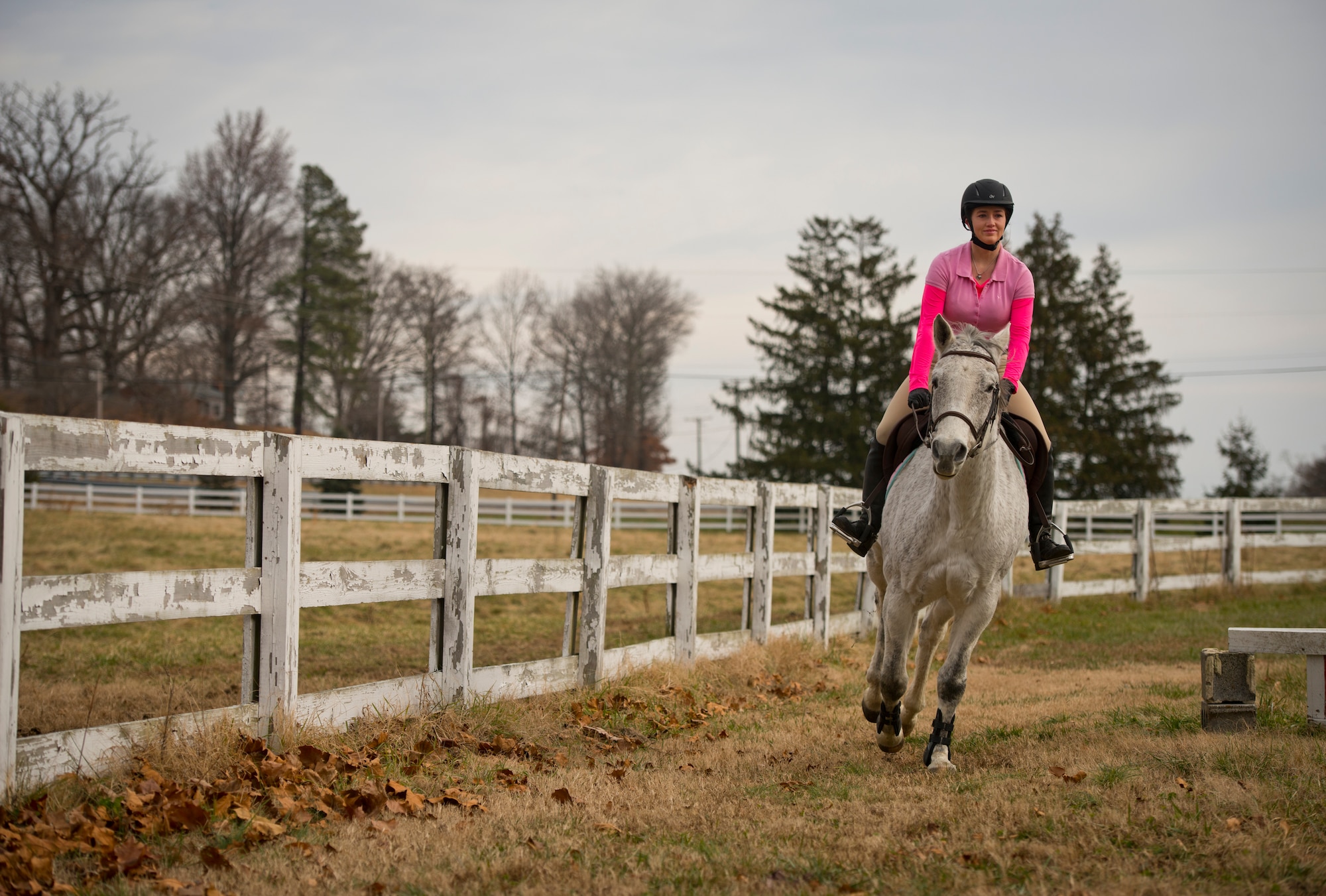 Airman 1st Class Kaitlyn Evans, an 11th Security Forces Squadron patrolman, rides her horse Kobalt in Lothian, Maryland. Evans, a North Carolina native, relocated her horse to Maryland at her own expense to continue competing with the horse. Spending about two hours of time with her horse has helped Evans cope physically and mentally as she begins her military career. (U.S. Air Force photo/Staff Sgt. Vernon Young Jr.)