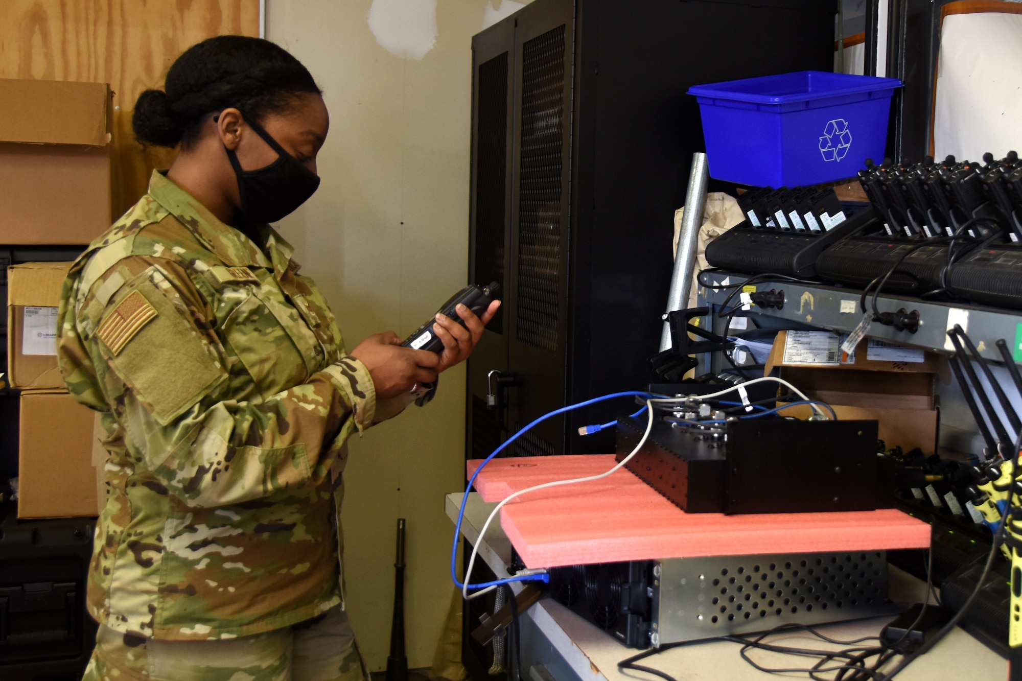 U.S. Air Force Staff Sgt. Tiffany Greene, 145th Communications Flight, tests a hand-held radio at the North Carolina Air National Guard Base, Charlotte Douglas International Airport, April 11, 2021. Greene was in communications for six years in the U.S. Army National Guard before joining the Air National Guard in 2021.
