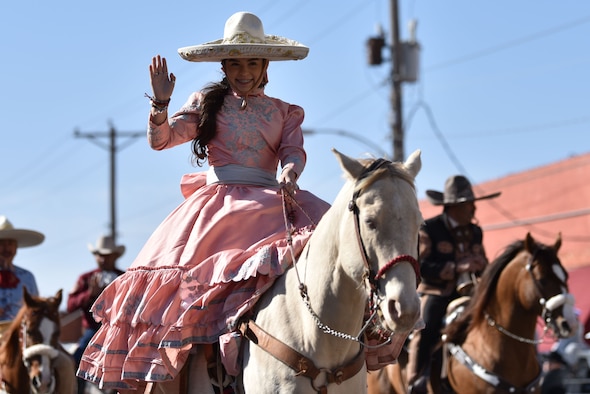 A Charros De Rancho Cabrera rider waves during the 89th Annual San Angelo Rodeo parade through downtown San Angelo, Texas, April 10, 2021. The entries rode or drove through downtown while individuals could watch from the sidelines. (U.S. Air Force photo by Staff Sgt. Seraiah Wolf)